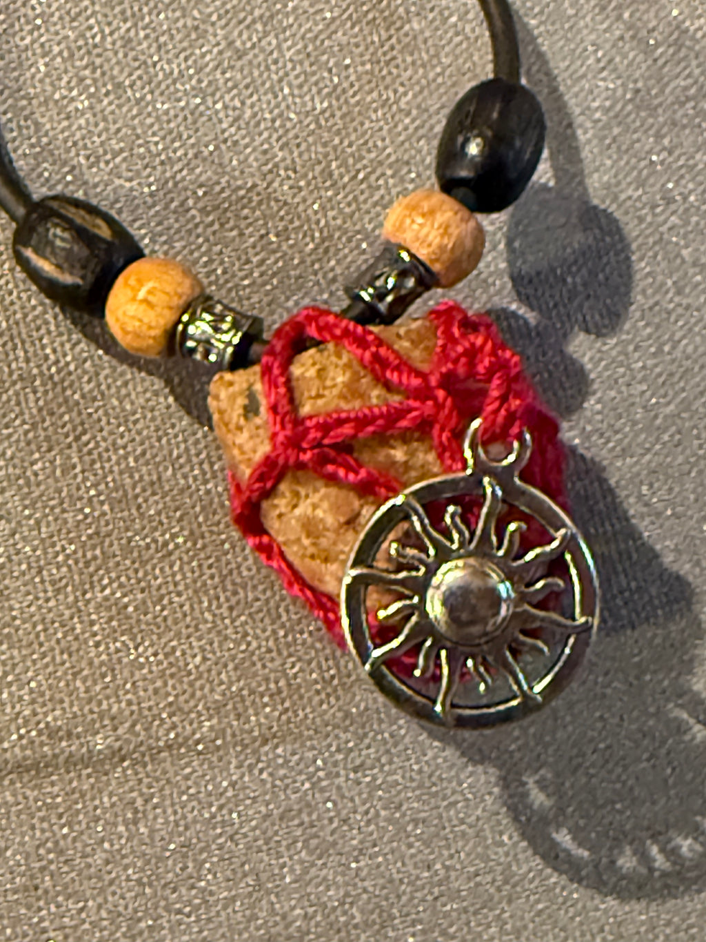 sun charm grounding stone necklace