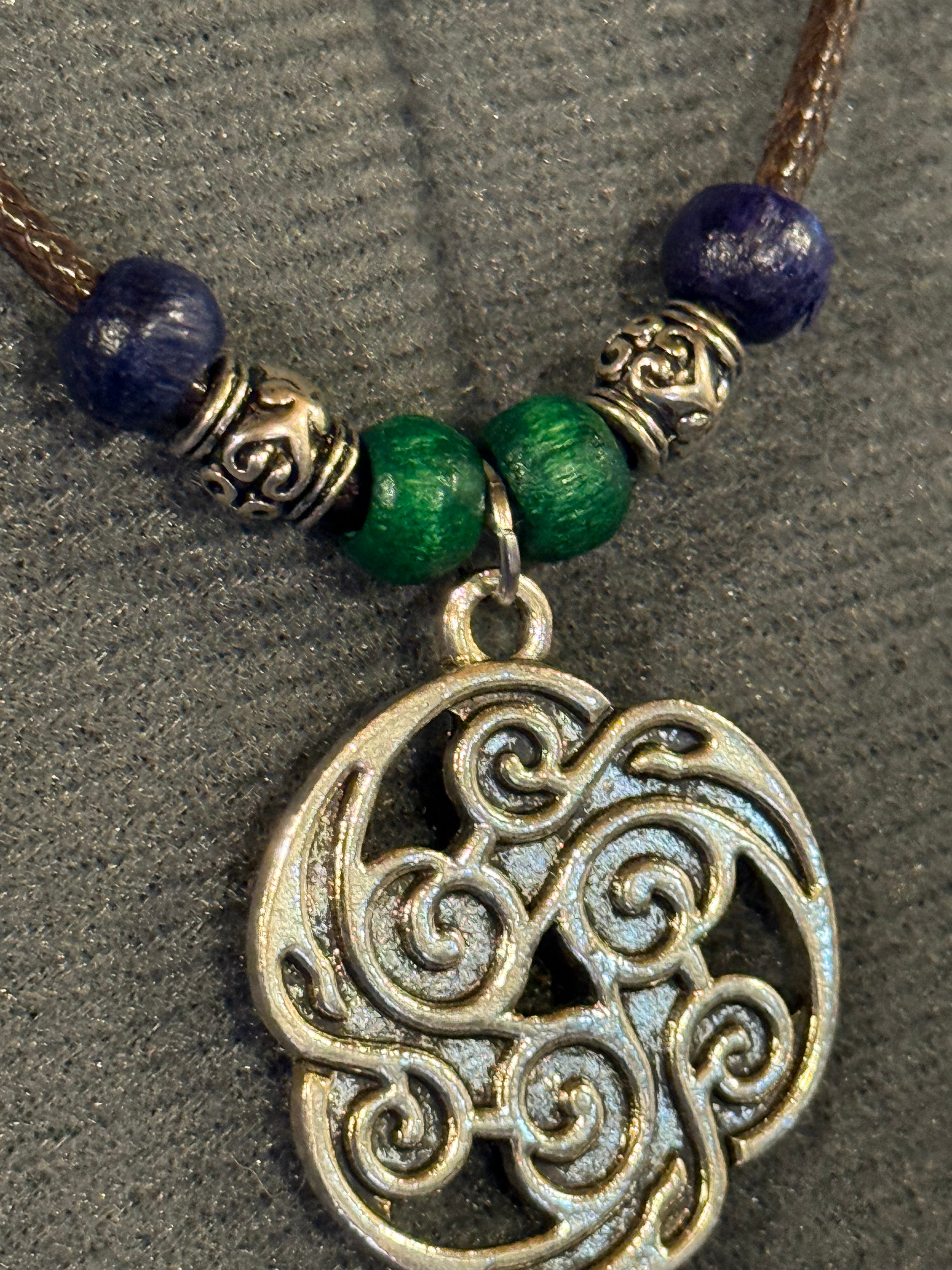celtic knot necklace with blue and green beads