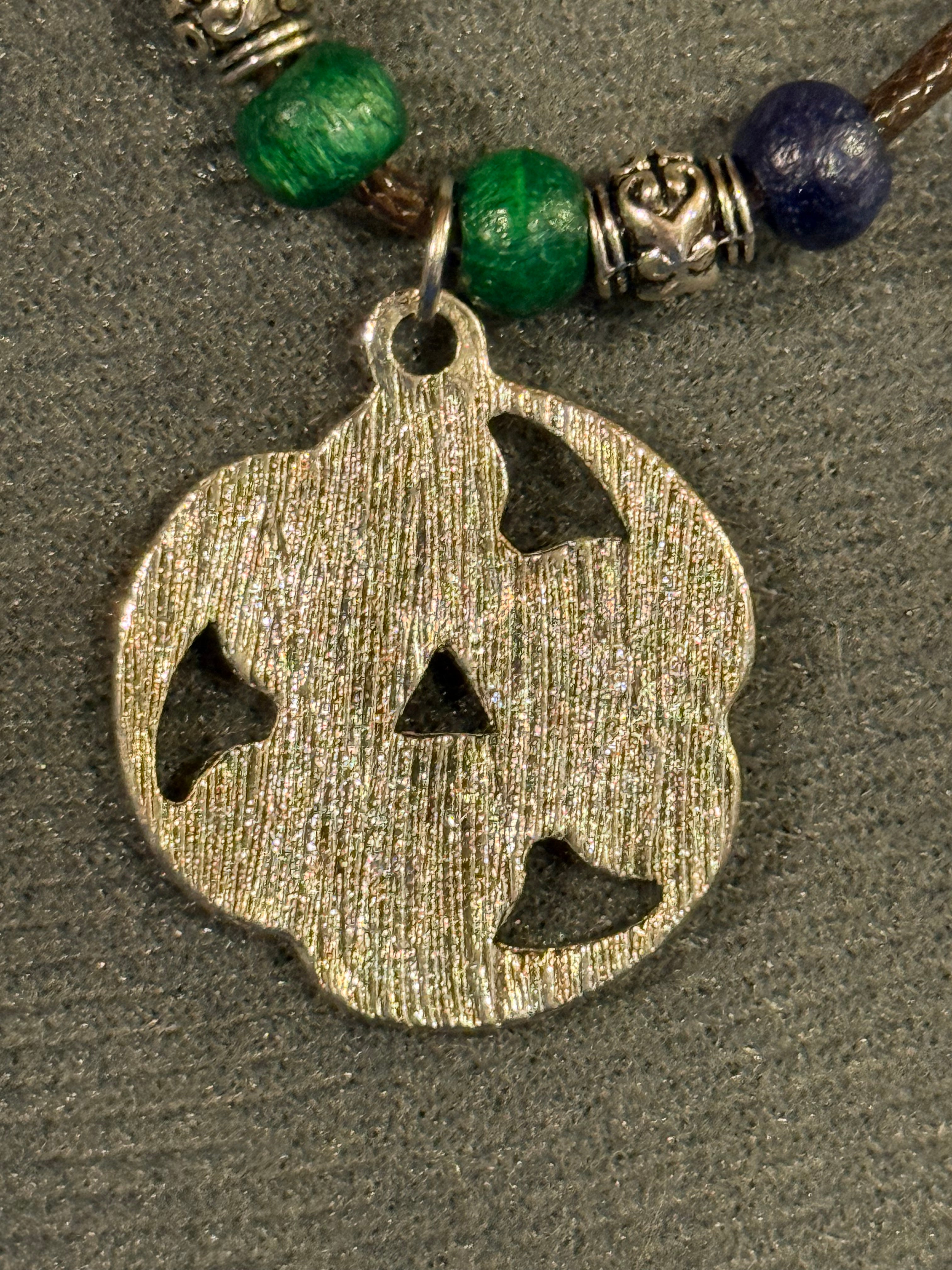 celtic knot necklace with blue and green beads