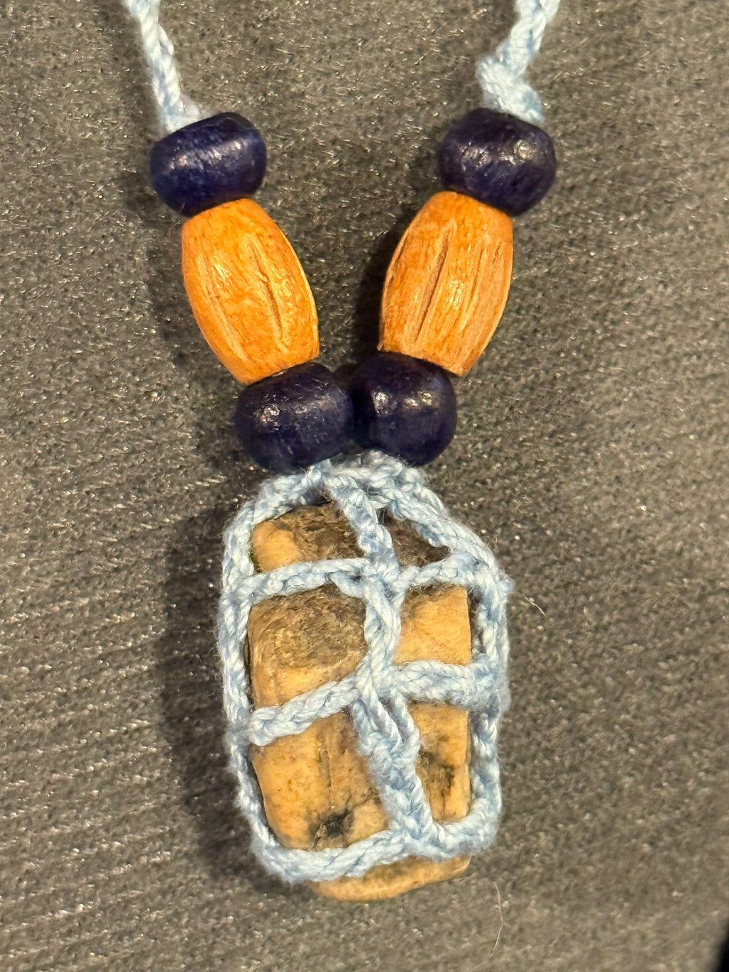 light blue grounding stone with wooden beads