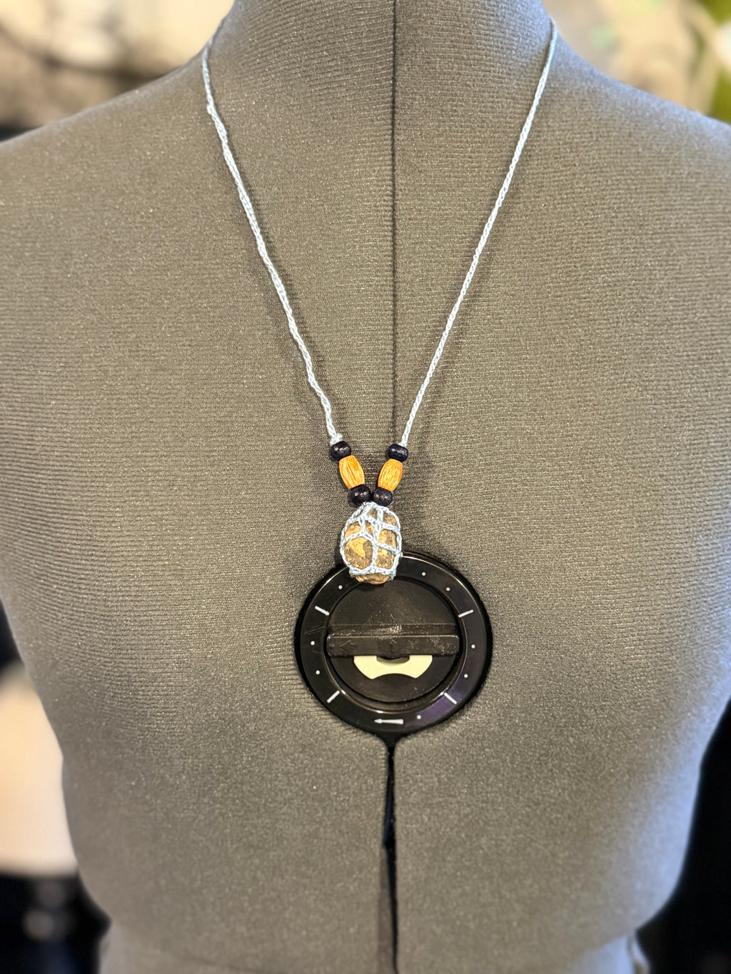 light blue grounding stone with wooden beads