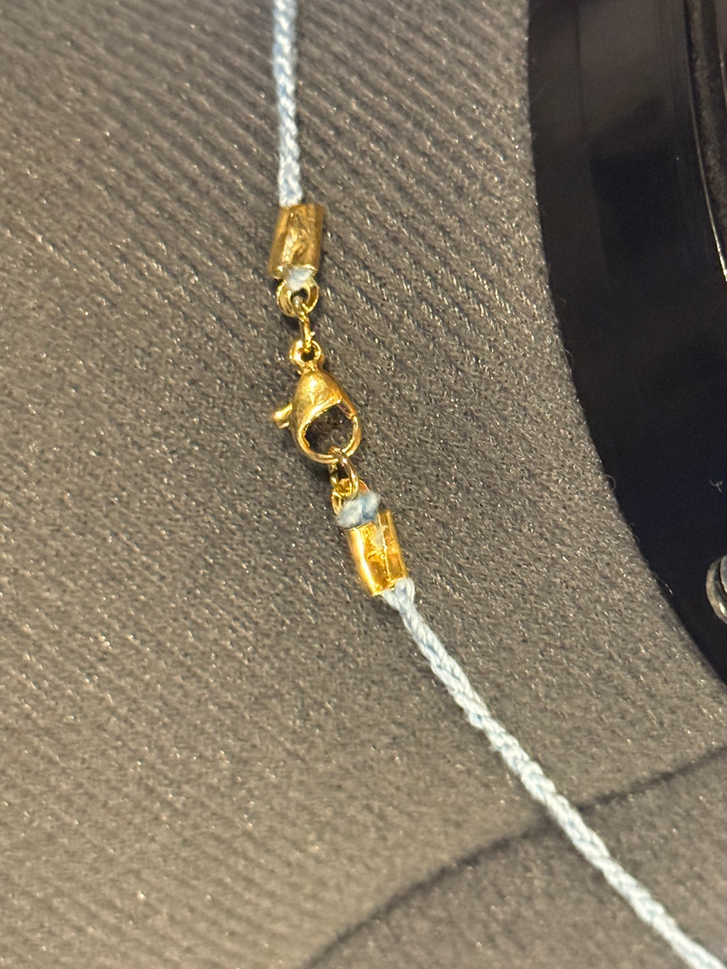 light blue grounding stone with wooden beads