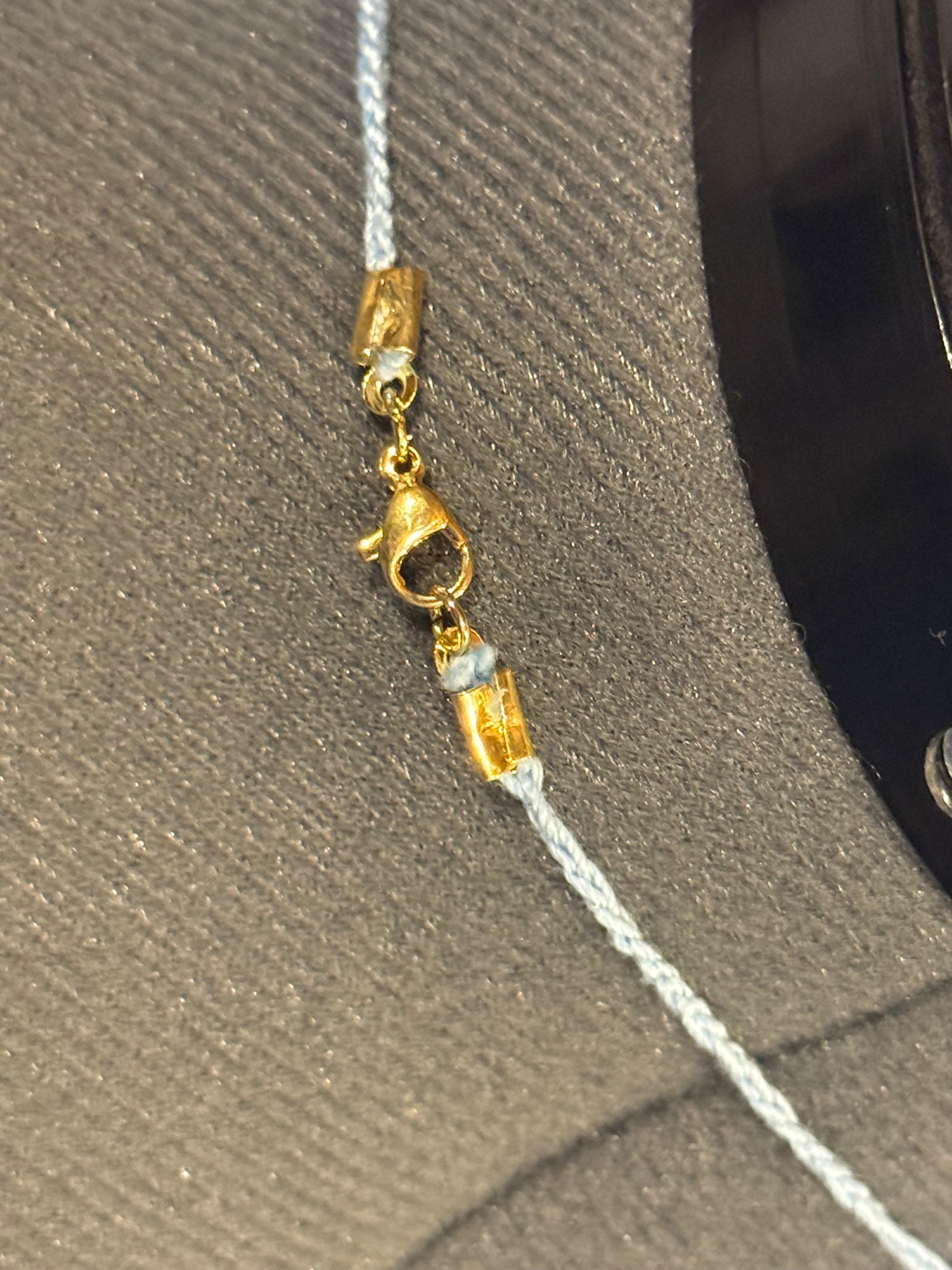 light blue grounding stone with wooden beads