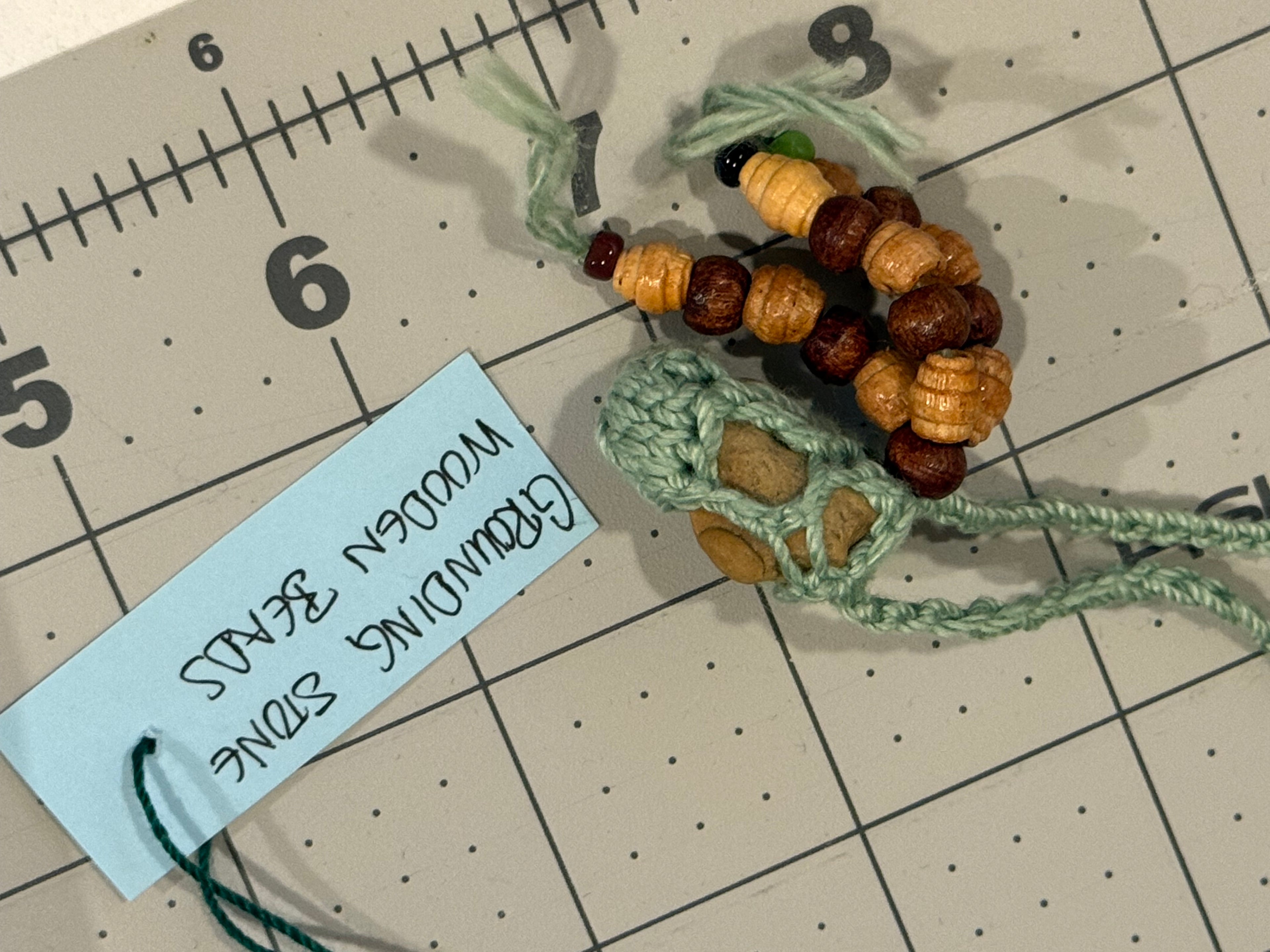 light green grounding stone necklace with wooden beads