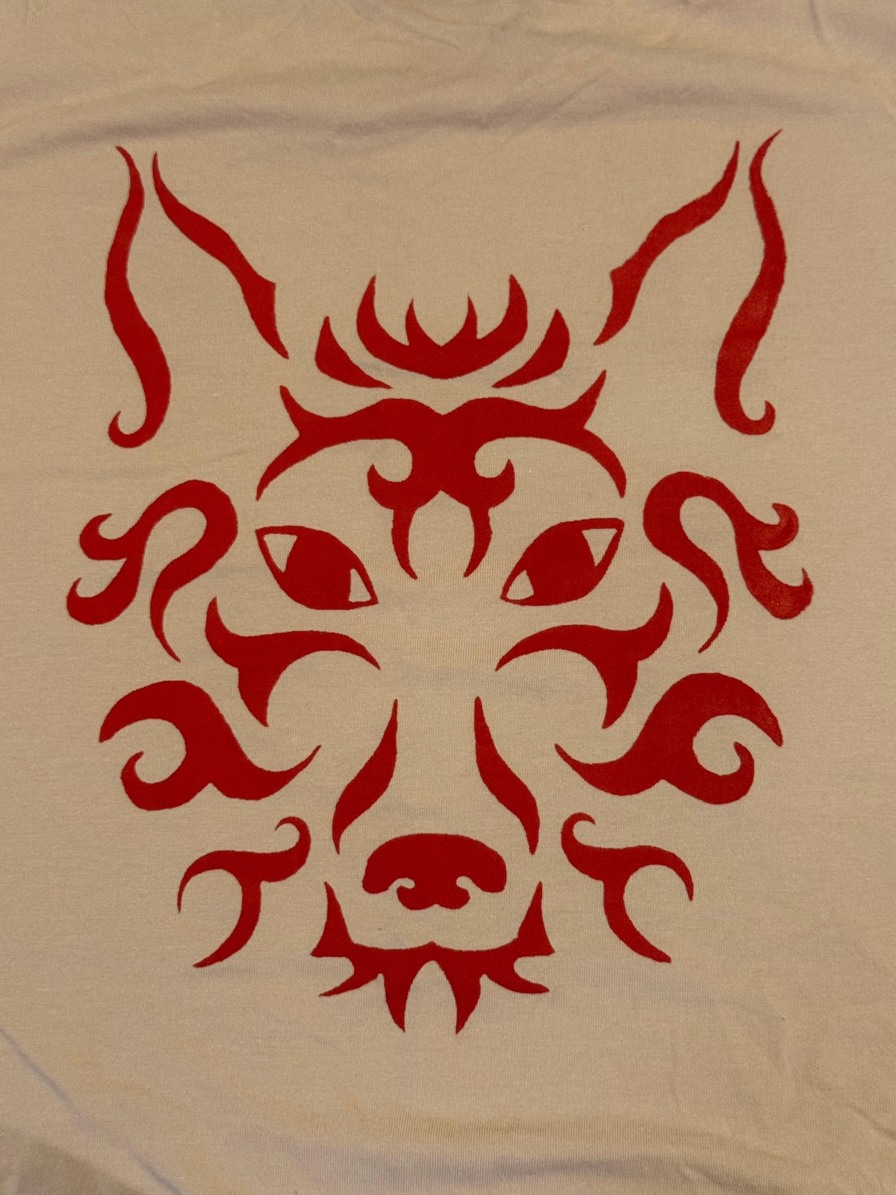 cream colored tank with red wolf
