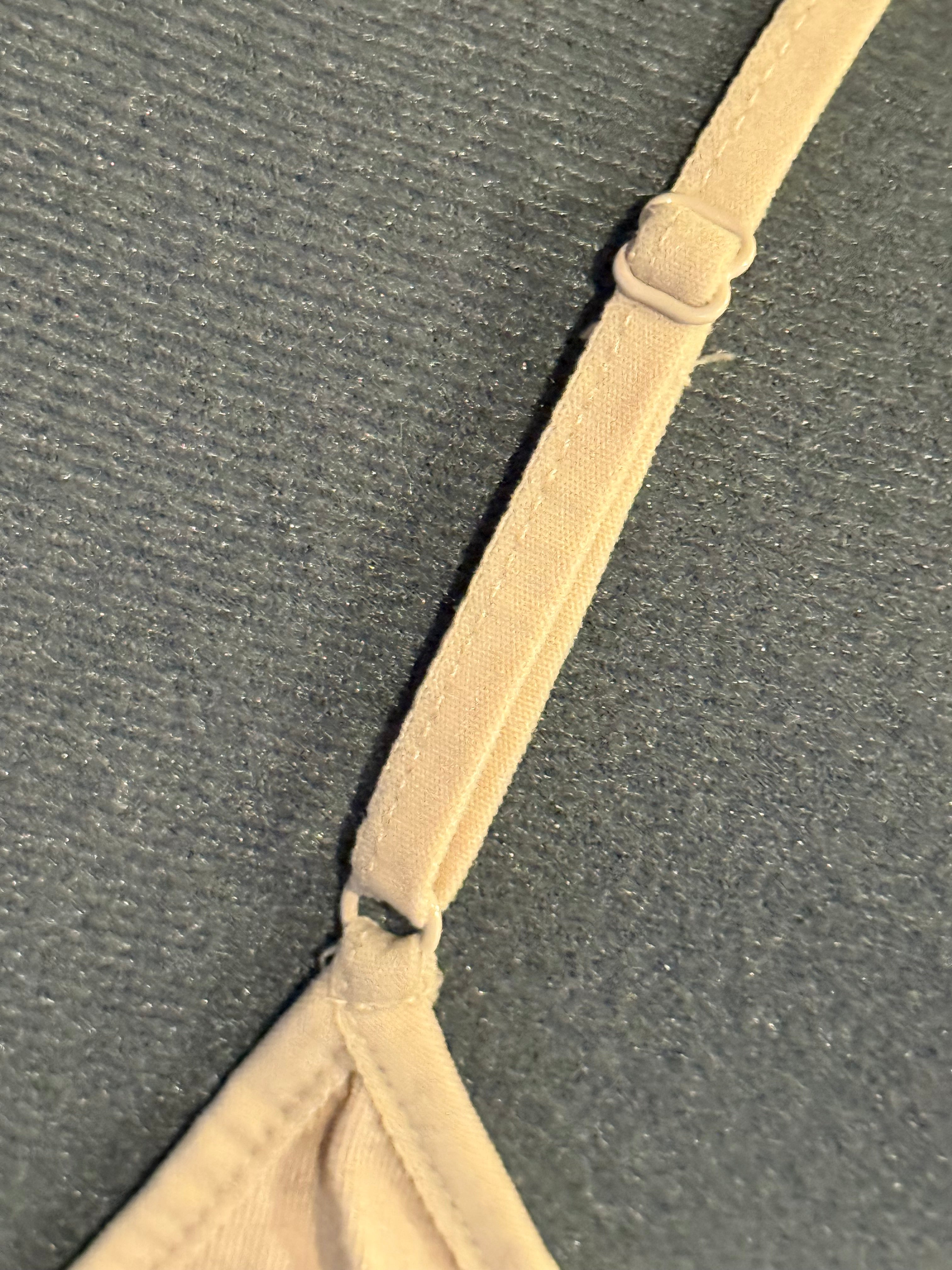 cream colored tank with red wolf