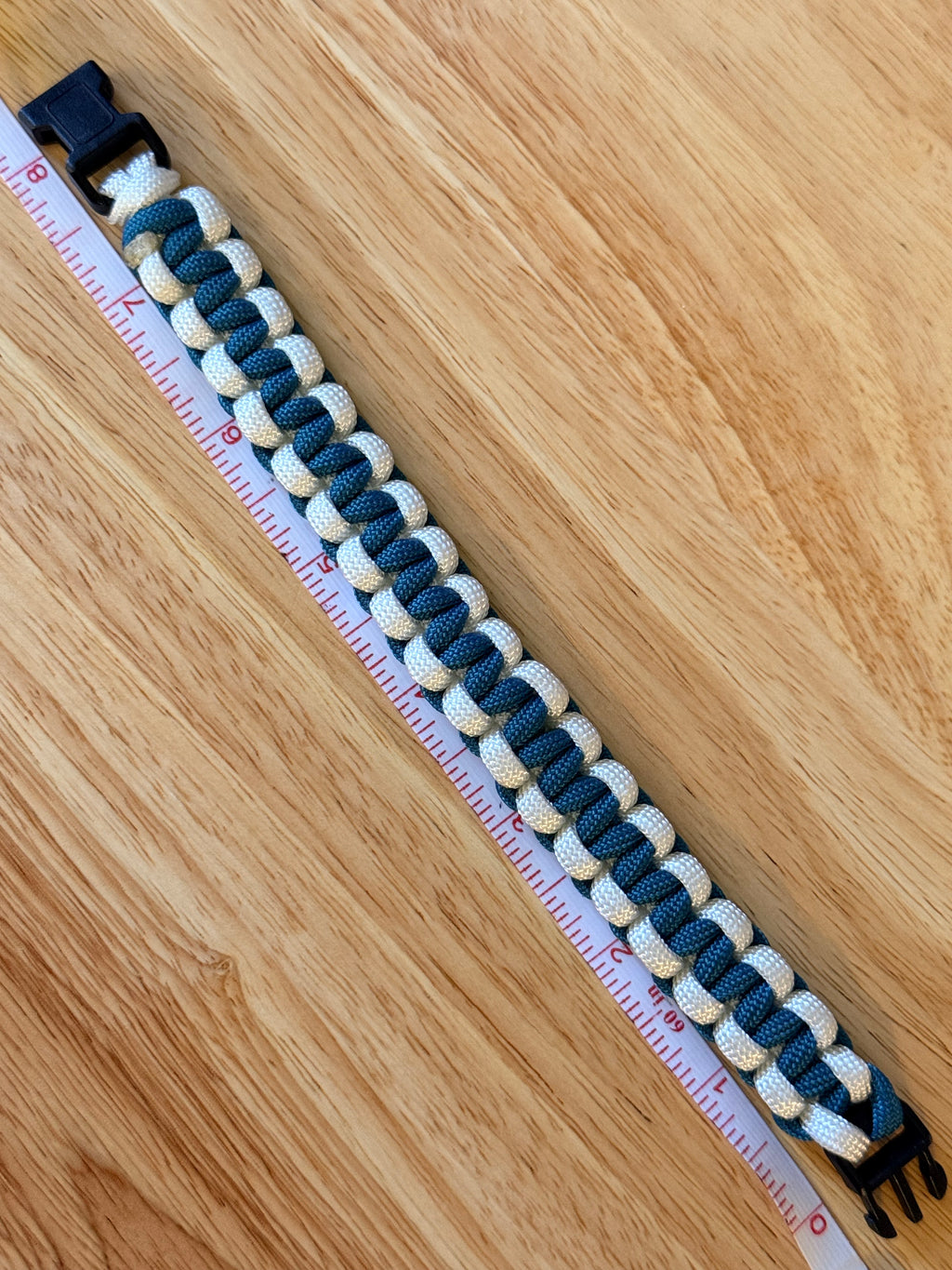 teal and white paracord bracelet