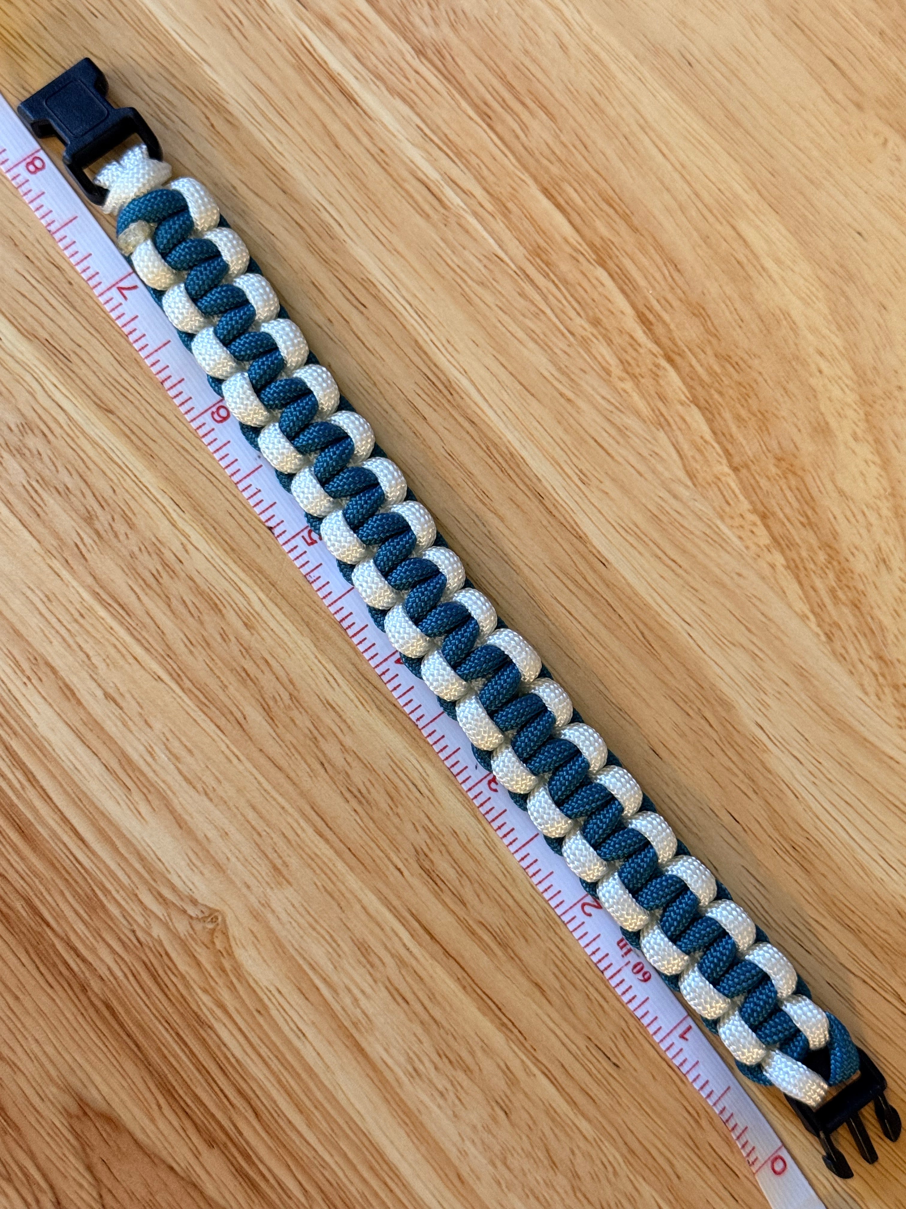 teal and white paracord bracelet