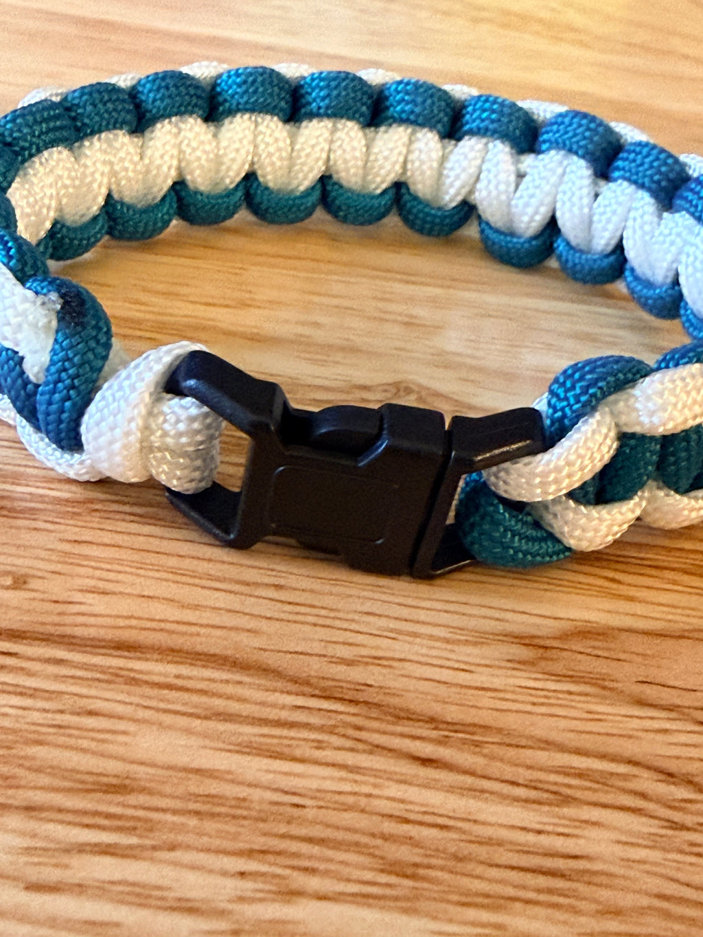 teal and white paracord bracelet