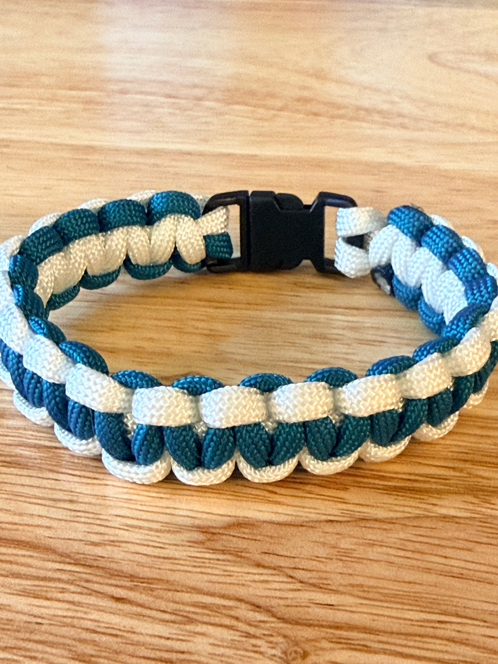 teal and white paracord bracelet