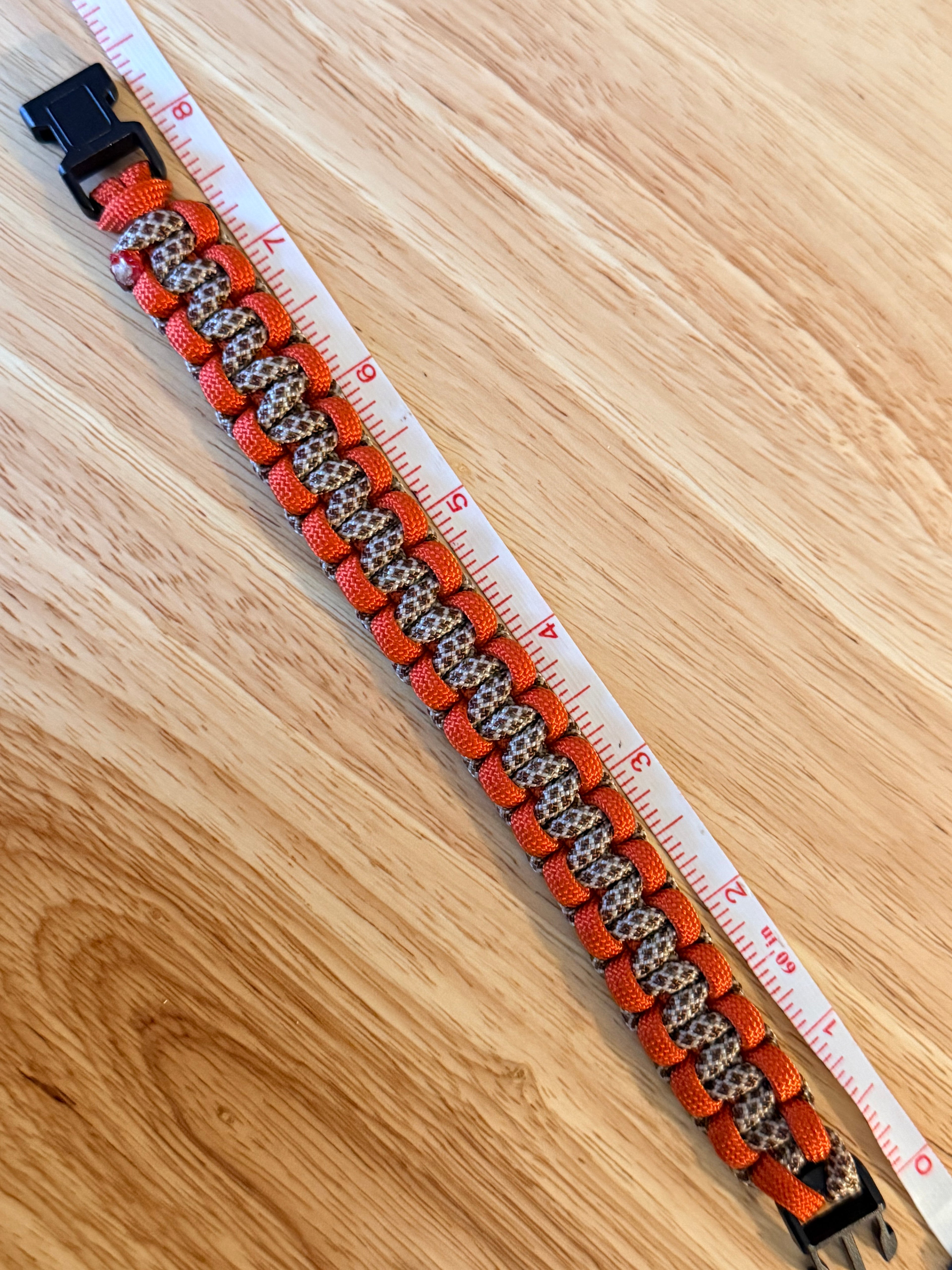 orange and brown paracord bracelet