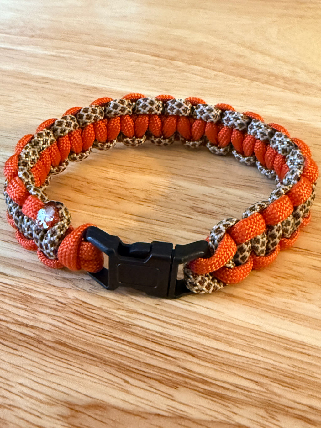 orange and brown paracord bracelet