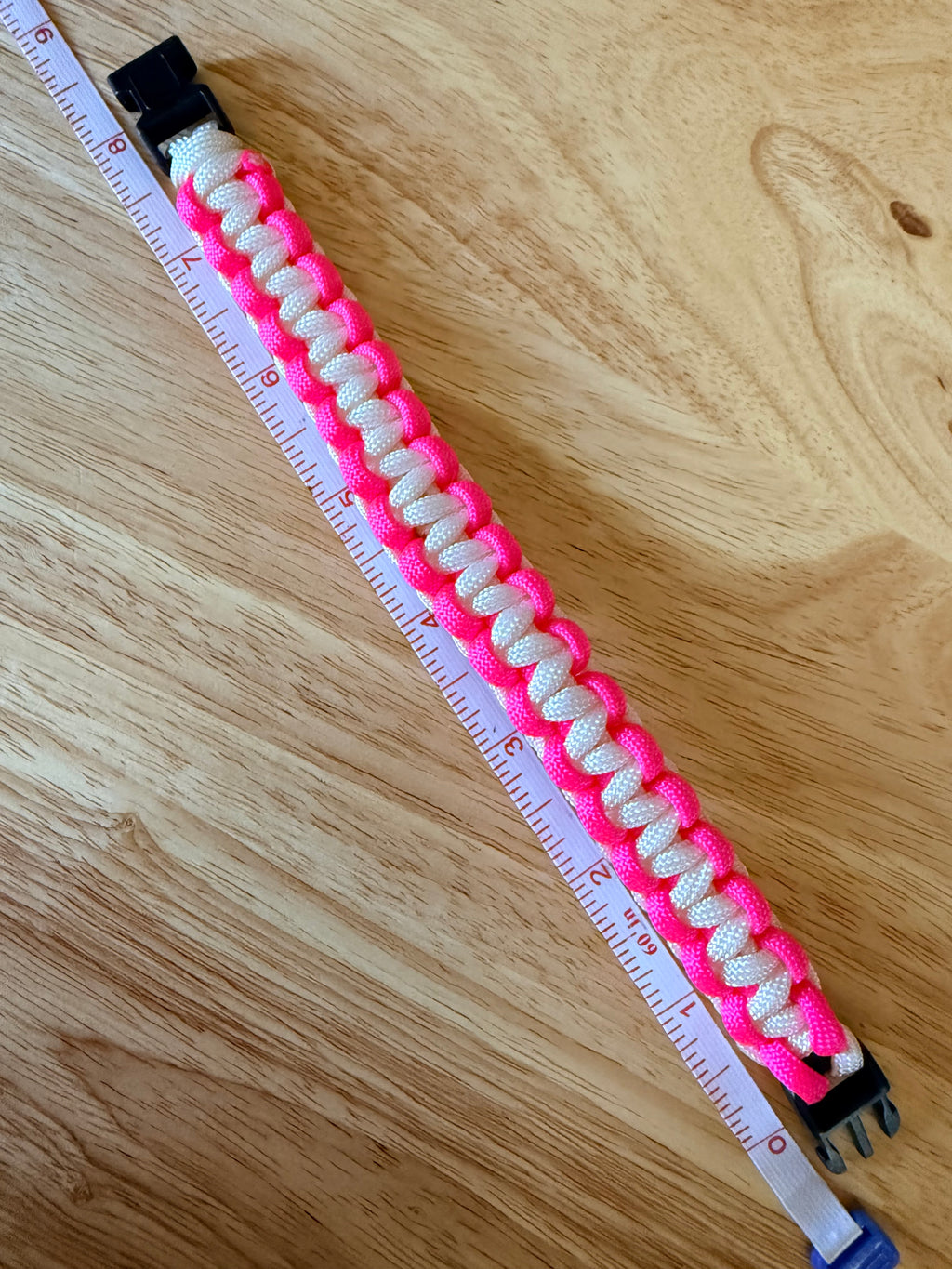 hot pink and white paracord bracelet