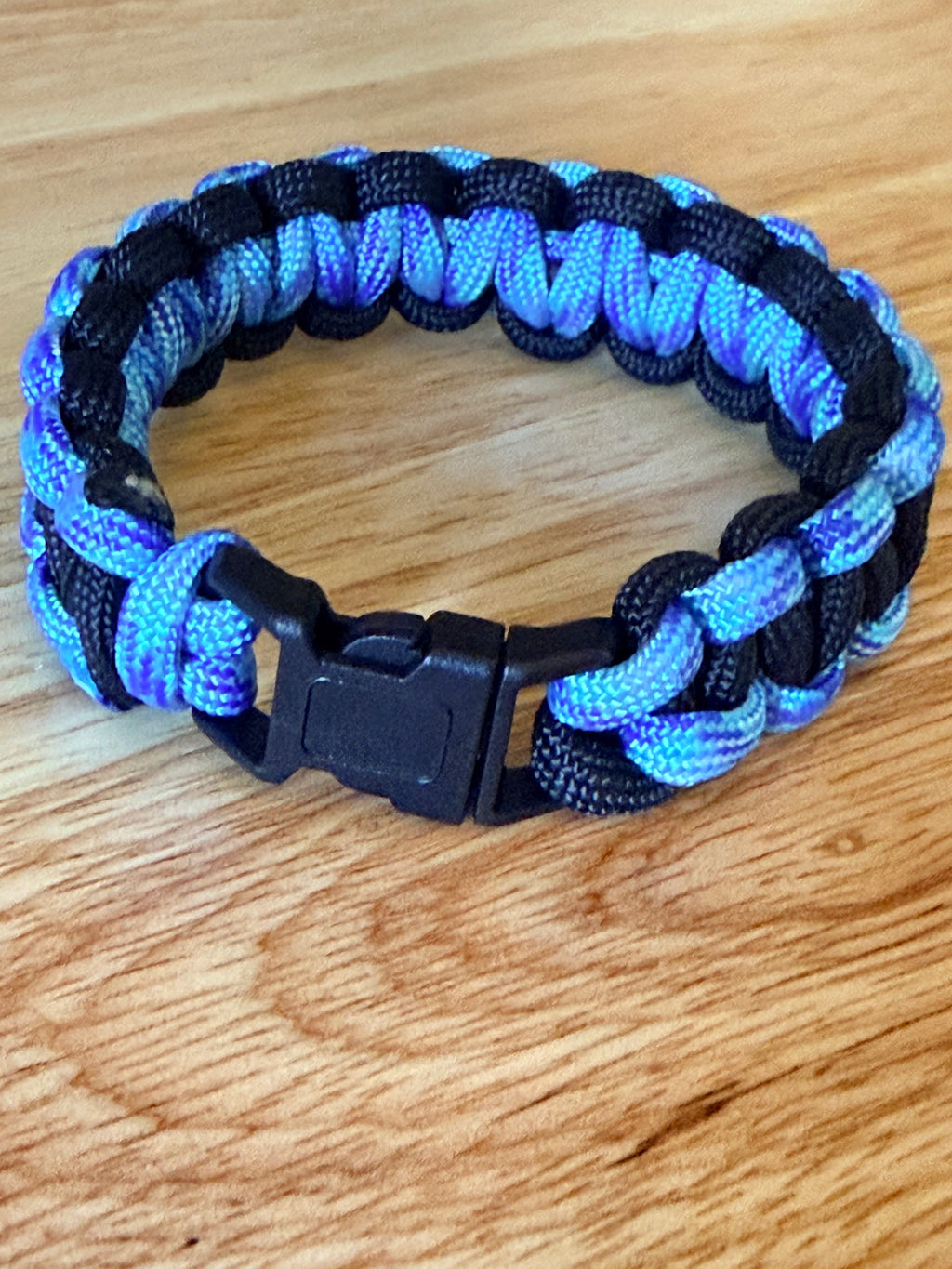 black and light blue/purple paracord bracelet