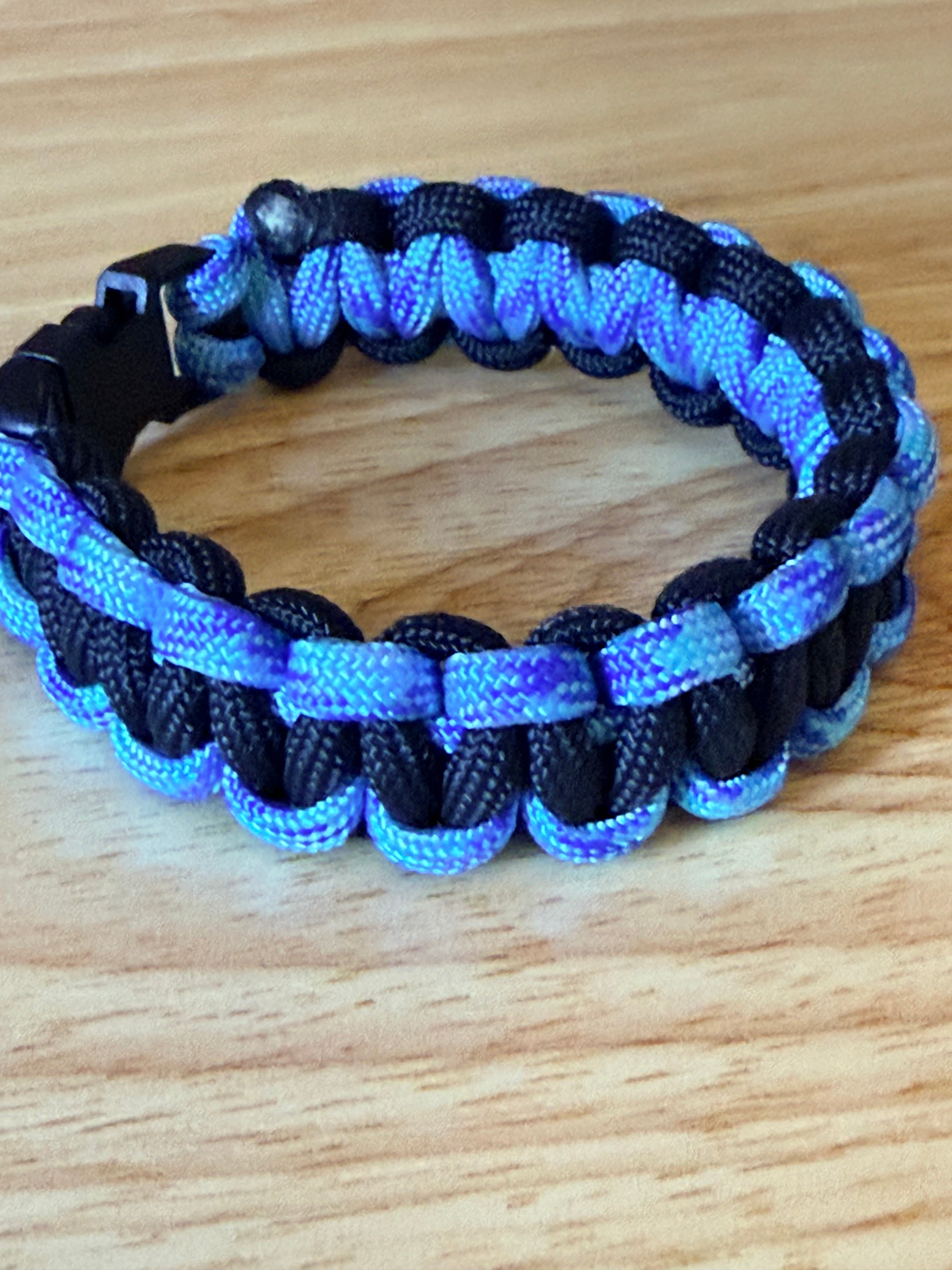 black and light blue/purple paracord bracelet