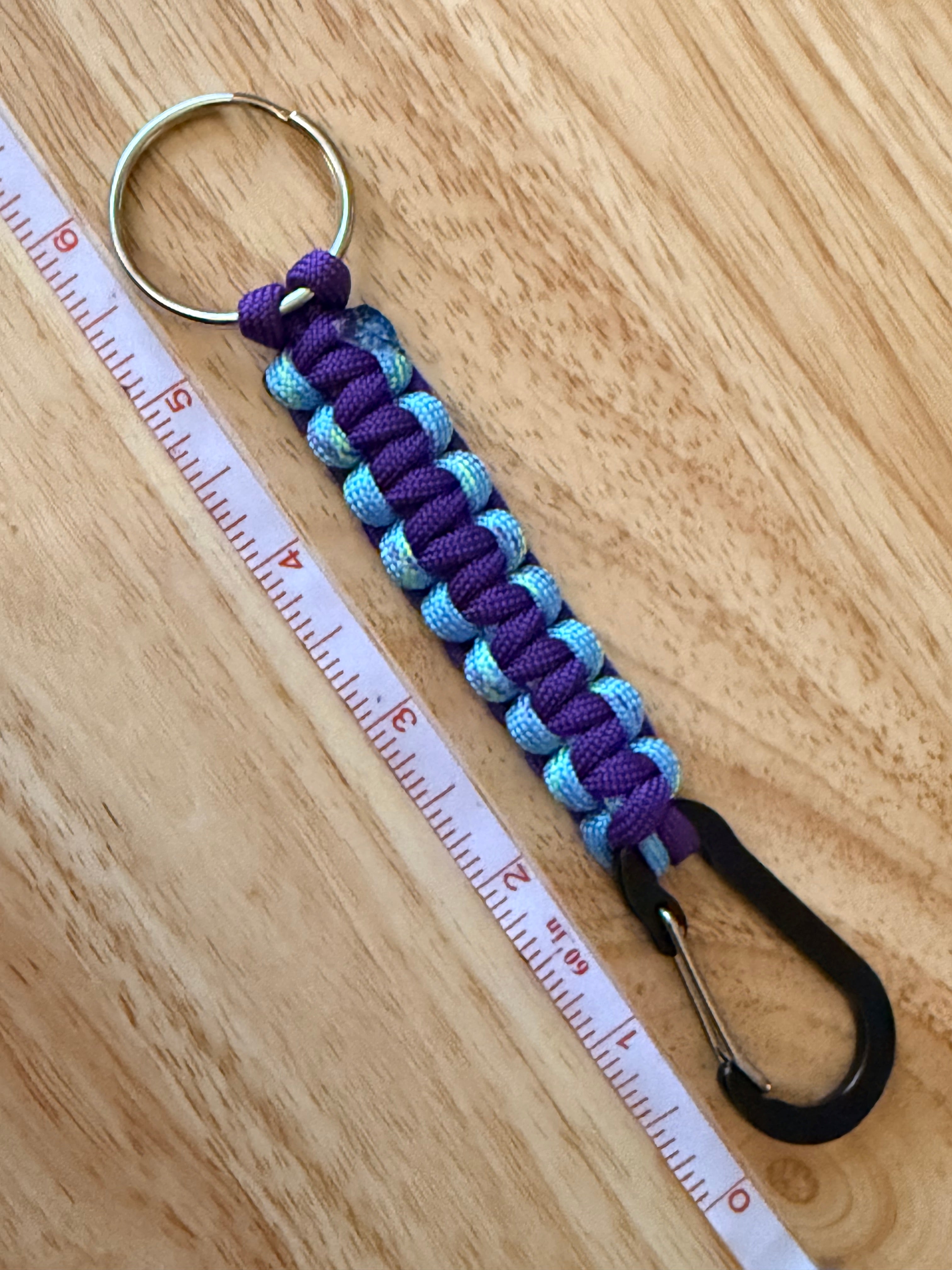 6 inch purple and light blue speckled with yellow and purple paracord key chain