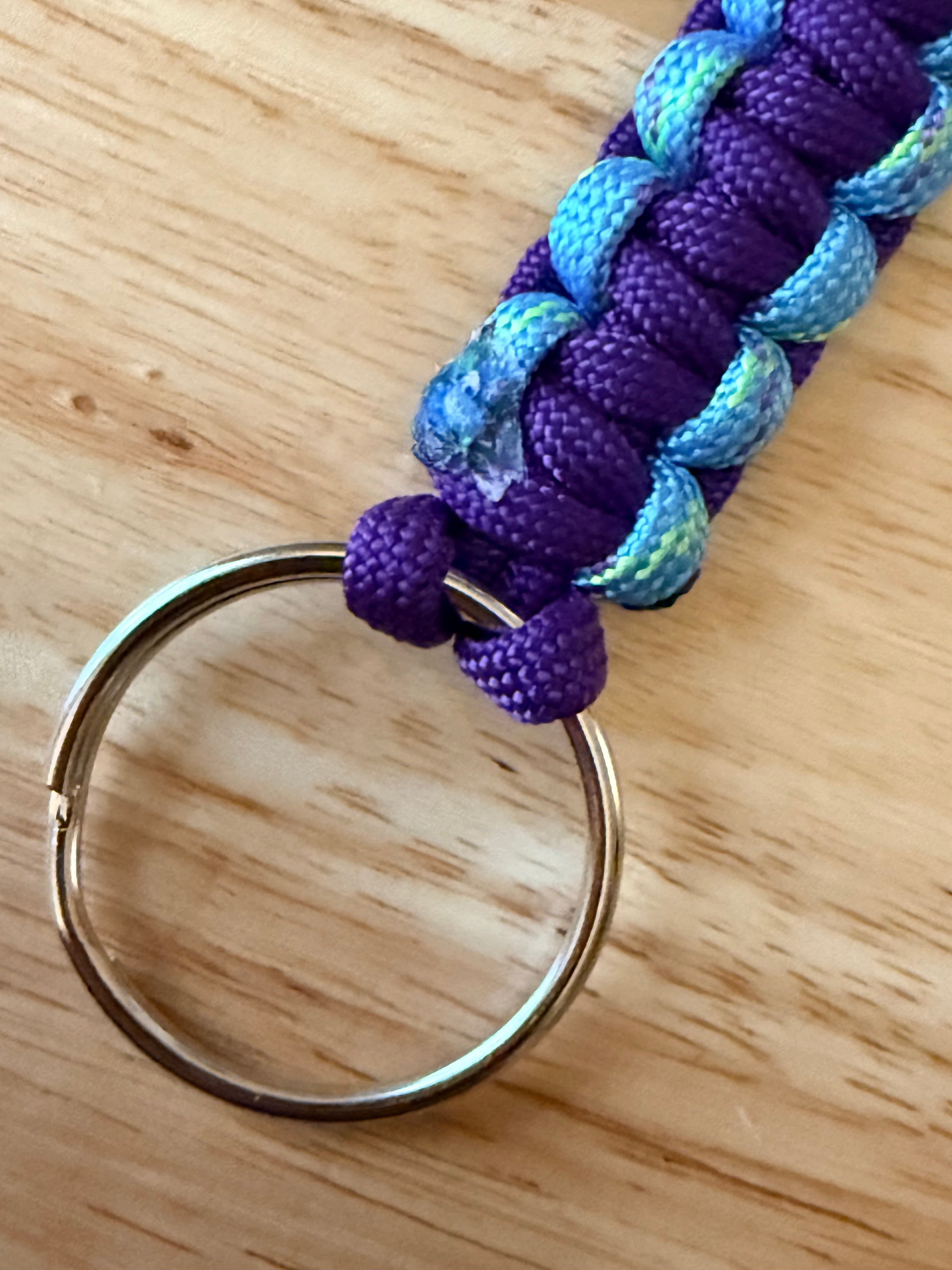 6 inch purple and light blue speckled with yellow and purple paracord key chain