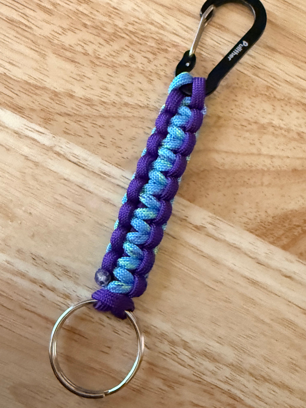 6 inch purple and light blue speckled with yellow and purple paracord key chain