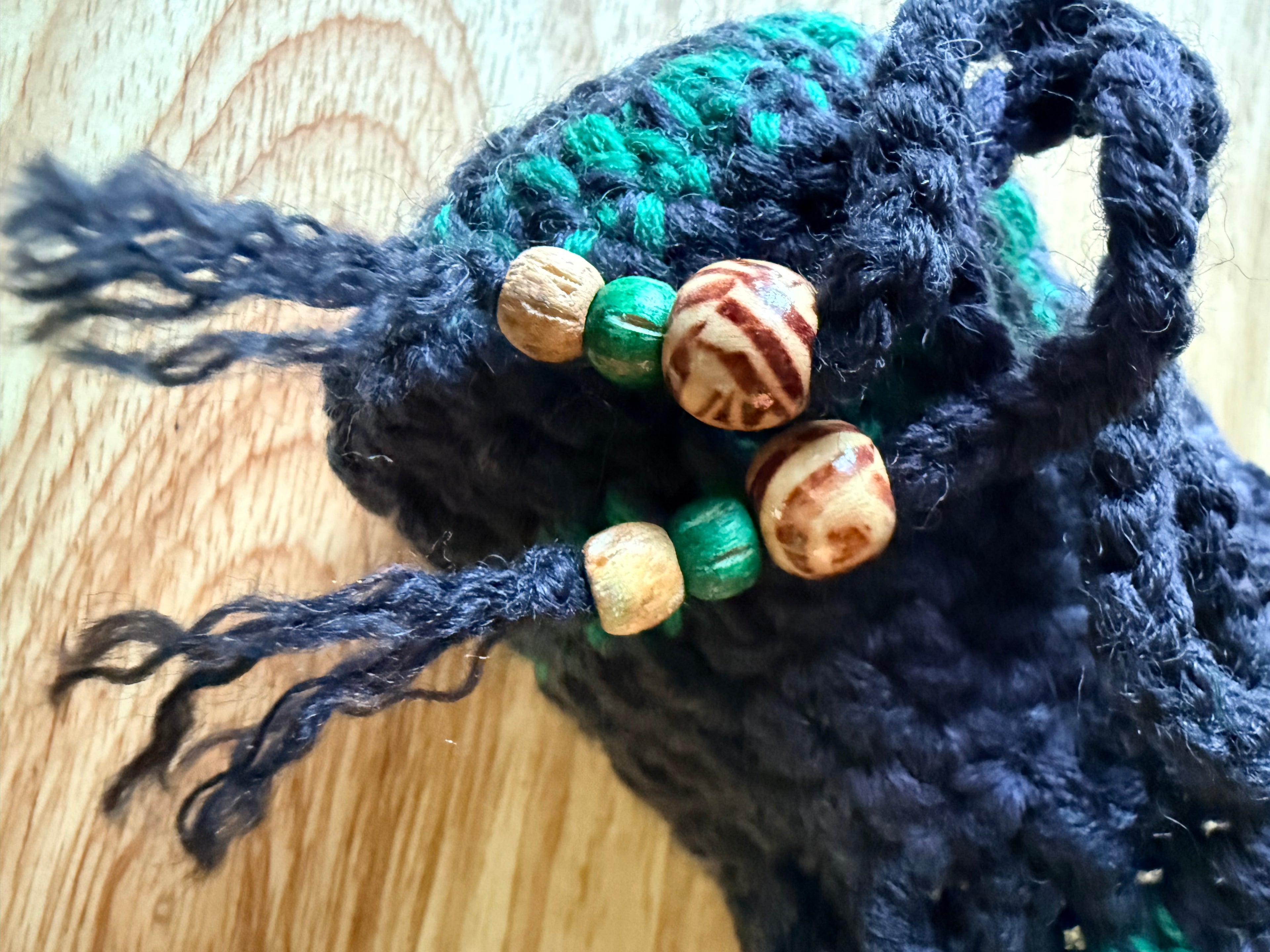 charcoal and green dice bag with 1 set of dice