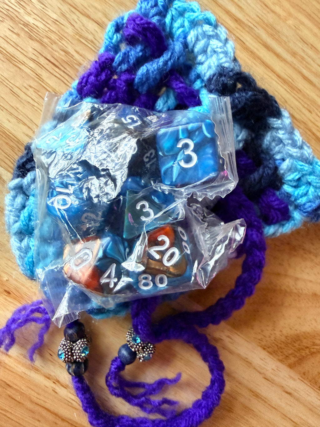blues and purple dice bag