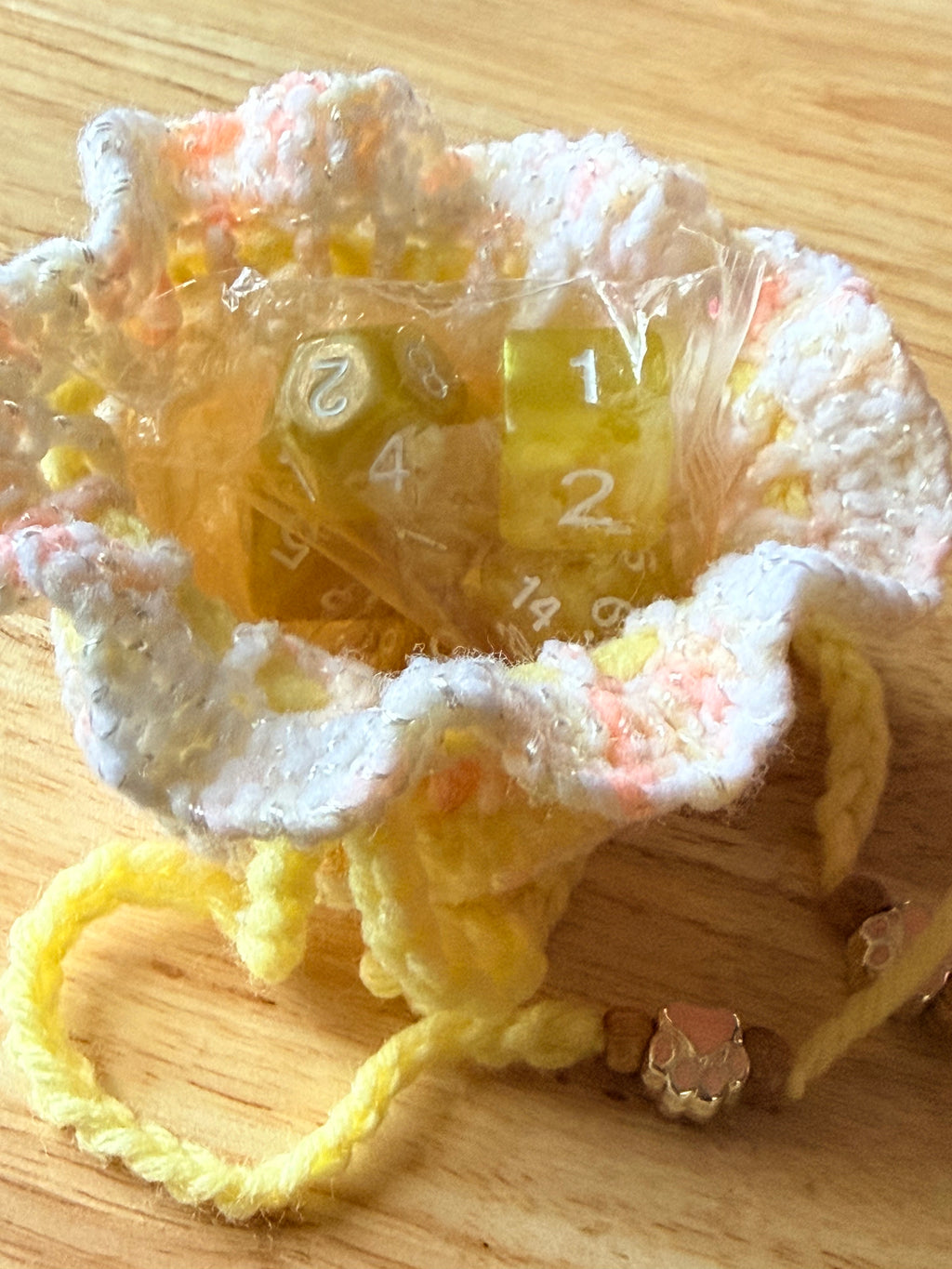 peach and yellow dice bag
