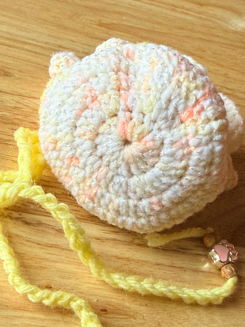 peach and yellow dice bag