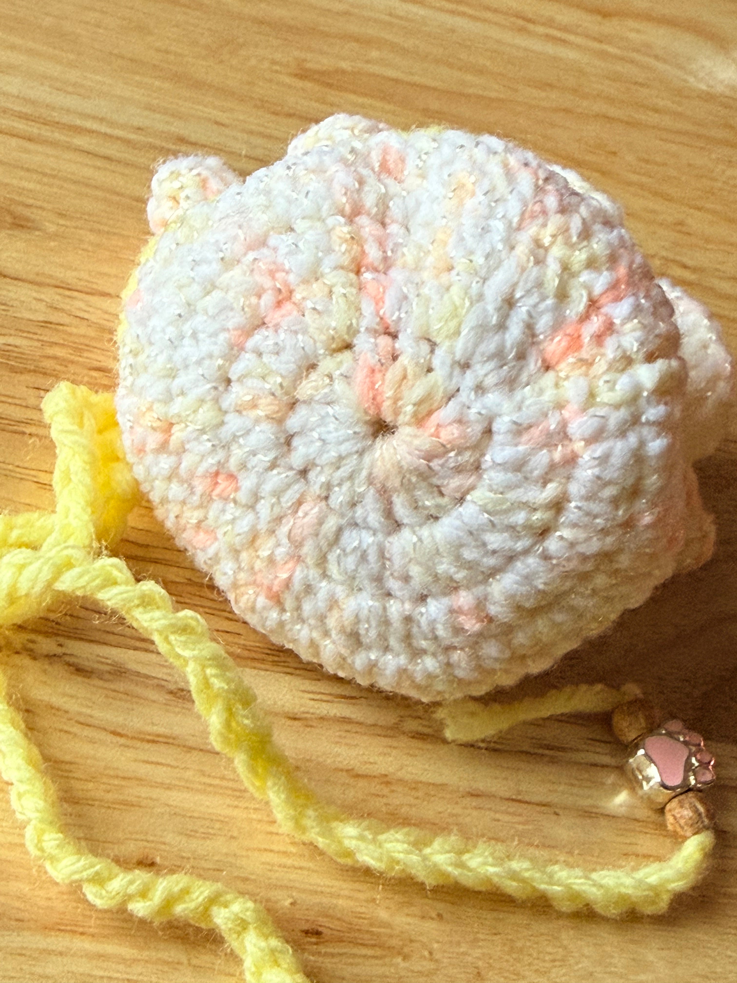 peach and yellow dice bag